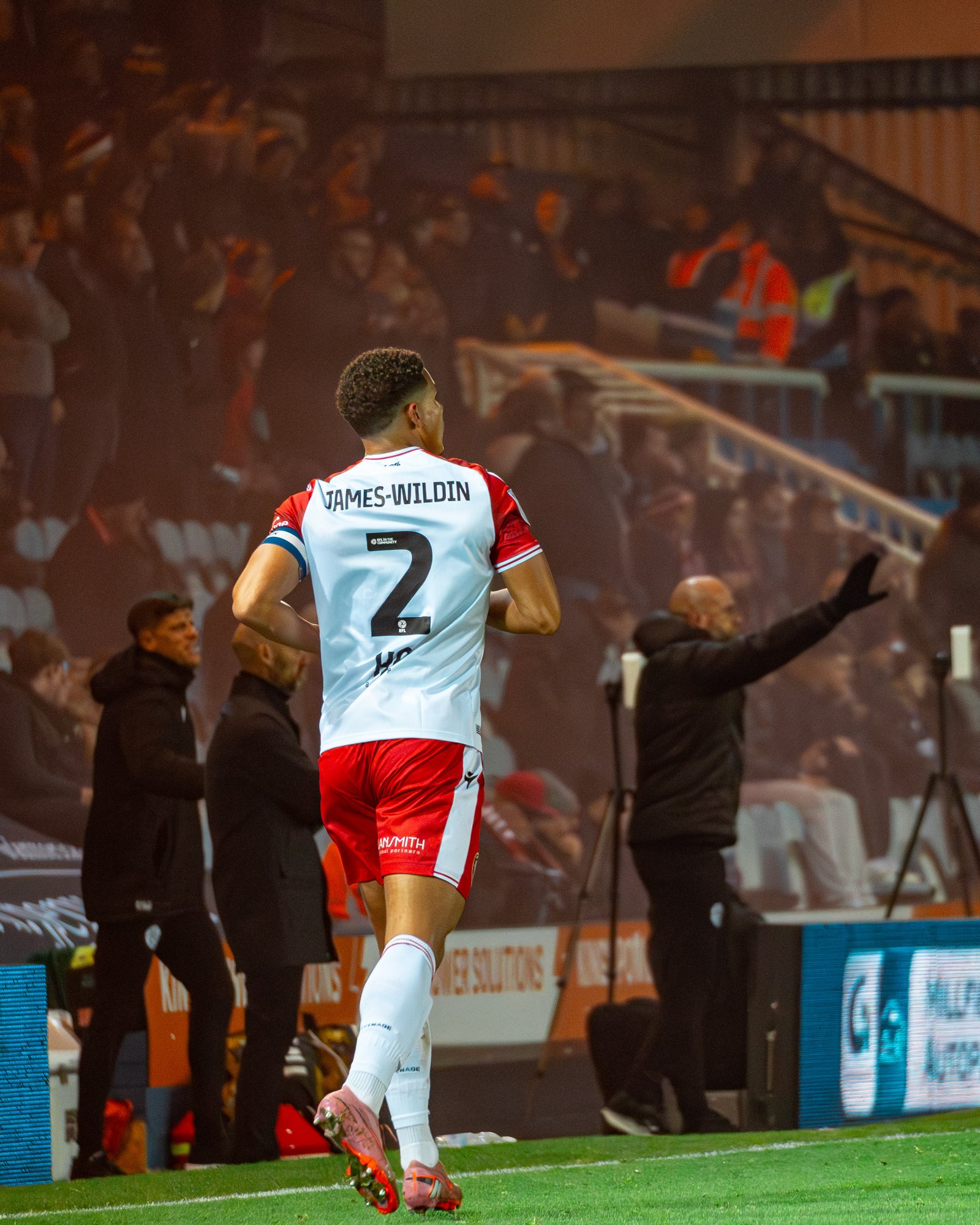 Luther James-Wildin #2 walking onto pitch with name on back